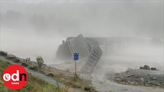 Bridge washed away by raging floodwater in New Zealand [upl. by Sears]